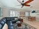 Comfortable living area featuring wood floors and lots of natural light at 10016 Spoonbill E Rd, Bradenton, FL 34209