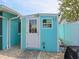 Exterior view of shed with white door and window at 10016 Spoonbill E Rd, Bradenton, FL 34209