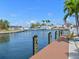 Scenic waterfront view featuring a dock and a serene canal at 10016 Spoonbill E Rd, Bradenton, FL 34209