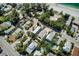 Aerial view of residential neighborhood with lush landscaping, pools, and close proximity to the beach at 104 29Th St # 3, Holmes Beach, FL 34217