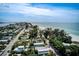 Scenic aerial view captures the neighborhood's proximity to the ocean and the beauty of the coastline at 104 29Th St # 3, Holmes Beach, FL 34217
