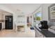 Bright dining area with tile floors, a white table set, and sliding glass doors to a patio at 104 29Th St # 3, Holmes Beach, FL 34217