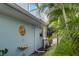 Unique exterior detail showcasing a decorative lion head sculpture and a shell fountain at 104 29Th St # 3, Holmes Beach, FL 34217