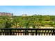 Balcony view of lush park-like grounds and nearby buildings at 1064 N Tamiami Trl # 1425, Sarasota, FL 34236
