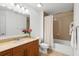 This bright bathroom features a shower-tub, a toilet, and a vanity at 1064 N Tamiami Trl # 1425, Sarasota, FL 34236