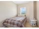 This cozy bedroom features a twin bed, neutral walls, and a bedside table at 1064 N Tamiami Trl # 1425, Sarasota, FL 34236