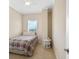 This cozy bedroom features a twin bed, neutral walls, and a bedside table at 1064 N Tamiami Trl # 1425, Sarasota, FL 34236