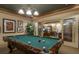Billiards room with a professional-grade pool table and seating area for guests and residents at 1064 N Tamiami Trl # 1425, Sarasota, FL 34236