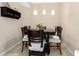 Cozy dining room with a dark wood table, comfortable chairs, and pendant lighting at 1064 N Tamiami Trl # 1425, Sarasota, FL 34236