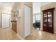 Neutral color kitchen, dining, and sitting area leading to a private balcony at 1064 N Tamiami Trl # 1425, Sarasota, FL 34236