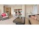 Inviting living room with wicker seating and a pass-through view of the kitchen at 1064 N Tamiami Trl # 1425, Sarasota, FL 34236