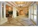 A grand lobby with decorative columns, tile flooring, and chandelier at 1064 N Tamiami Trl # 1425, Sarasota, FL 34236