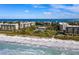 Beautiful aerial view of beachfront condos and pristine sandy beach along the gulf coast at 1095 Gulf Of Mexico Dr # 503, Longboat Key, FL 34228