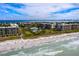 Stunning aerial view of beachfront condos and pristine sandy beach along the gulf coast at 1095 Gulf Of Mexico Dr # 503, Longboat Key, FL 34228