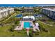 Community features a large pool, deck, and beautiful landscaping between condos and beachfront at 1095 Gulf Of Mexico Dr # 503, Longboat Key, FL 34228