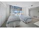 Bedroom with twin beds, closet space and lots of natural light at 1095 Gulf Of Mexico Dr # 503, Longboat Key, FL 34228