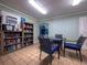 Inviting community room with a vending machine, a bookshelf with books, and a table with chairs at 1095 Gulf Of Mexico Dr # 503, Longboat Key, FL 34228