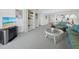 Open concept living area with carpeted floors and decor leading to the kitchen and other rooms at 1095 Gulf Of Mexico Dr # 503, Longboat Key, FL 34228