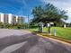 Parking area with a car wash and electric charging station located next to lush landscaping at 1095 Gulf Of Mexico Dr # 503, Longboat Key, FL 34228