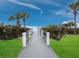 A walkway leads to a beautiful beach with ocean views at 1095 Gulf Of Mexico Dr # 503, Longboat Key, FL 34228