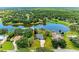 Beautiful aerial view of lakeside home featuring lush greenery and serene water views at 1103 134Th E St, Bradenton, FL 34212
