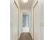 Hallway view into a well-lit bathroom with modern features at 1103 134Th E St, Bradenton, FL 34212