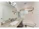 Updated bathroom features a granite countertop, white subway tiles, and a shower-tub combo at 1103 134Th E St, Bradenton, FL 34212
