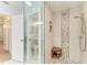 Modern bathroom featuring a frameless glass shower with bench and stone accents at 1103 134Th E St, Bradenton, FL 34212