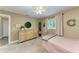 Cozy bedroom with a large window, a ceiling fan and a dresser at 1103 134Th E St, Bradenton, FL 34212