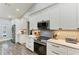 Well-equipped kitchen features stainless appliances, white cabinets, and ample counter space at 1103 134Th E St, Bradenton, FL 34212