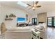 Comfortable living room with a stone fireplace, vaulted ceiling, and access to the outdoor space at 1103 134Th E St, Bradenton, FL 34212