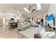 Spacious open-concept living area with skylights, island kitchen and wood floors at 1103 134Th E St, Bradenton, FL 34212