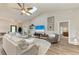 Well-lit living room with a view of the entryway, wood flooring and comfortable seating at 1103 134Th E St, Bradenton, FL 34212