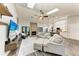 Bright open-concept living room featuring skylights, wood flooring, and a cozy stone fireplace at 1103 134Th E St, Bradenton, FL 34212