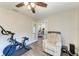 Bright home office with chair, exercise equipment, and view to other rooms at 1103 134Th E St, Bradenton, FL 34212