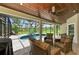 Inviting screened-in patio features a pool, hot tub, ceiling fan, and serene views at 1103 134Th E St, Bradenton, FL 34212