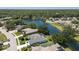 Beautiful lakefront homes featuring manicured lawns and mature trees for maximum privacy in a serene neighborhood at 12005 Summer Meadow Dr, Lakewood Ranch, FL 34202