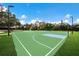 Brightly painted full-sized basketball court in a well-maintained community park, perfect for friendly games and exercise at 12005 Summer Meadow Dr, Lakewood Ranch, FL 34202