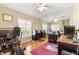 Well-lit home office with hardwood floors, mirrors, and exercise equipment at 12005 Summer Meadow Dr, Lakewood Ranch, FL 34202