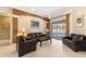 Cozy living room with tile floors, comfortable leather sofas and view of the pool at 12005 Summer Meadow Dr, Lakewood Ranch, FL 34202