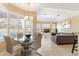 Open concept living and dining area with shuttered windows and natural lighting at 12005 Summer Meadow Dr, Lakewood Ranch, FL 34202