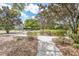 Enjoy a scenic walk through the community park on paved trails surrounded by lush landscaping and mature trees at 12005 Summer Meadow Dr, Lakewood Ranch, FL 34202