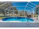 Enclosed swimming pool area featuring a spa and peaceful backyard views at 12005 Summer Meadow Dr, Lakewood Ranch, FL 34202