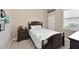 Comfortable bedroom featuring wood floors, a matching bed set, and a nautical-themed comforter at 15451 27Th E Ct, Parrish, FL 34219