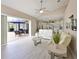 An open floor plan that seamlessly connects the living room, kitchen, and an outdoor screened lanai with a pool at 15451 27Th E Ct, Parrish, FL 34219