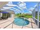 Sparkling pool area with spa and screened enclosure, offering a relaxing outdoor space at 15451 27Th E Ct, Parrish, FL 34219
