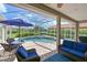 Enclosed pool area with a lounge area and a view of the lake at 15451 27Th E Ct, Parrish, FL 34219