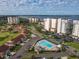 Expansive aerial view highlighting a community with condos, single Gathering homes, golf course, and waterfront at 1714 Fairway Trce, Palmetto, FL 34221