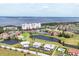 Beautiful community aerial view showcases a golf course, several ponds, single-story homes, and nearby condos at 1714 Fairway Trce, Palmetto, FL 34221