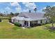 Aerial view showcasing property, landscaping, patio, and surrounding golf course at 1714 Fairway Trce, Palmetto, FL 34221
